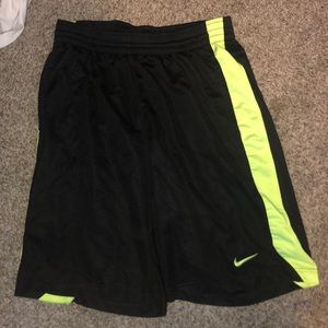 Black nike shorts with a neon green strip